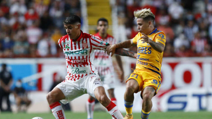 José Antonio Lopez (left) and Necaxa upset the Tigres, knocking them off the top of the Liga MX table. (Photo by Leopoldo Smith/Getty Images)