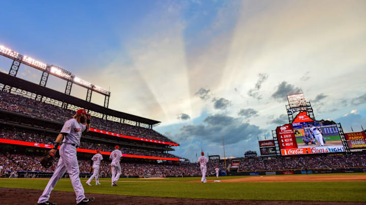 FanDuel MLB: DENVER, CO - JULY 4: Charlie Blackmon #19 of the Colorado Rockies and his teammates take the field for the eighth inning as stripes from the setting sun appear in the sky at Coors Field on July 4, 2018 in Denver, Colorado. (Photo by Dustin Bradford/Getty Images)