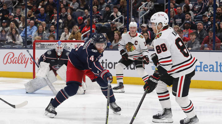 Dec 31, 2022; Columbus, Ohio, USA; Chicago Blackhawks right wing Patrick Kane (88) looks to pass as Columbus Blue Jackets defenseman Vladislav Gavrikov (4) defends during the second period at Nationwide Arena. Mandatory Credit: Russell LaBounty-USA TODAY Sports