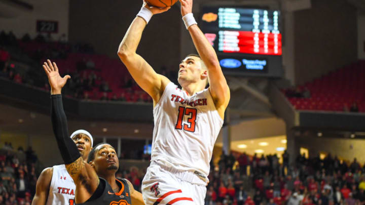 LUBBOCK, TX - FEBRUARY 27: Matt Mooney #13 of the Texas Tech Red Raiders shoots the ball over Curtis Jones #1 of the Oklahoma State Cowboys during overtime period of the game on February 27, 2019 at United Supermarkets Arena in Lubbock, Texas. Texas Tech defeated Oklahoma State 84-80 in overtime. (Photo by John Weast/Getty Images)