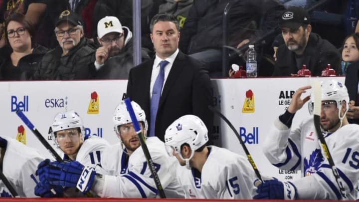 LAVAL, QC - DECEMBER 28: Head coach of the Toronto Marlies Greg Moore looks on from the bench against the Laval Rocket during the third period at Place Bell on December 28, 2019 in Laval, Canada. The Laval Rocket defeated the Toronto Marlies 6-1. (Photo by Minas Panagiotakis/Getty Images)