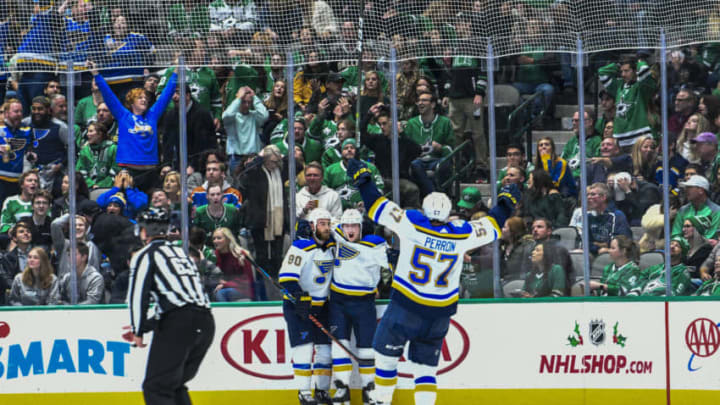 DALLAS, TX - NOVEMBER 29: David Perron #57, Ryan OReilly #90 and the St. Louis Blues celebrate a goal against the Dallas Stars at the American Airlines Center on November 29, 2019 in Dallas, Texas. (Photo by Glenn James/NHLI via Getty Images)