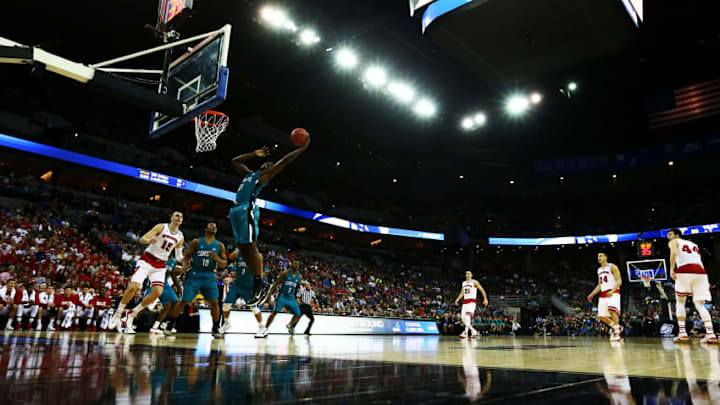 OMAHA, NE - MARCH 20: Tristian Curtis #21 of the Coastal Carolina Chanticleers goes up against the Wisconsin Badgers in the second half during the second round of the 2015 NCAA Men's Basketball Tournament at the CenturyLink Center on March 20, 2015 in Omaha, Nebraska. (Photo by Ronald Martinez/Getty Images)