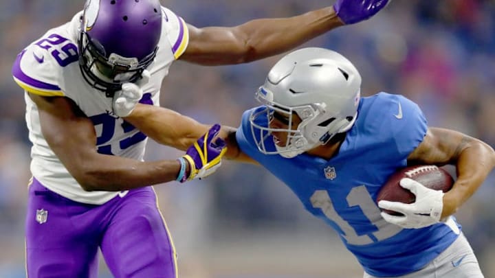 DETROIT, MI - NOVEMBER 23: Marvin Jones #11 of the Detroit Lions fights off defender Xavier Rhodes #29 of the Minnesota Vikings after catching a pass during the first half at Ford Field on November 23, 2017 in Detroit, Michigan. (Photo by Gregory Shamus/Getty Images)