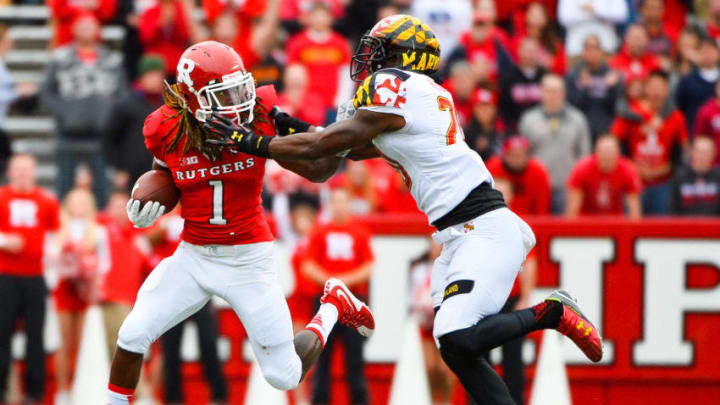 PISCATAWAY, NJ - NOVEMBER 28: Janarion Grant #1 of the Rutgers Scarlet Knights attempts to run past Anthony Nixon #20 of the Maryland Terrapins during a game at High Point Solutions Stadium on November 28, 2015 in Piscataway, New Jersey. (Photo by Alex Goodlett/Getty Images)