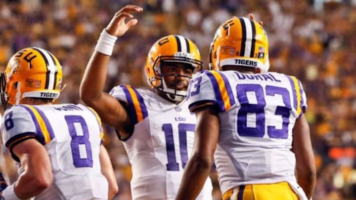 Sep 6, 2014; Baton Rouge, LA, USA; LSU Tigers quarterback Anthony Jennings (10) celebrates a touchdown pass to wide receiver Travin Dural (83) during the first half of a game against the Sam Houston State Bearkats at Tiger Stadium. Mandatory Credit: Derick E. Hingle-USA TODAY Sports Sep 6, 2014; Baton Rouge, LA, USA; LSU Tigers quarterback Anthony Jennings (10) celebrates a touchdown pass to wide receiver Travin Dural (83) during the first half of a game against the Sam Houston State Bearkats at Tiger Stadium. Mandatory Credit: Derick E. Hingle-USA TODAY Sports