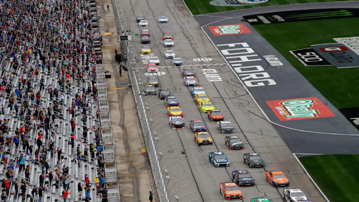 HAMPTON, GA - FEBRUARY 25: Kyle Busch, driver of the #18 Snickers Almond Toyota, and Ryan Newman, driver of the #31 Liberty National Chevrolet, lead the field to turn one after taking the green flag to start the Monster Energy NASCAR Cup Series Folds of Honor QuikTrip 500 at Atlanta Motor Speedway on February 25, 2018 in Hampton, Georgia. (Photo by Kevin C. Cox/Getty Images)