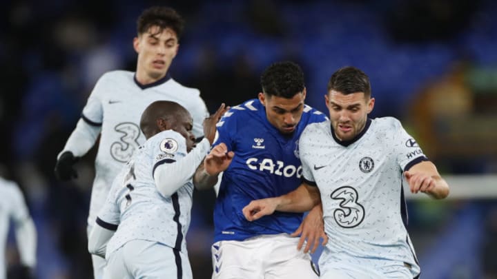 LIVERPOOL, ENGLAND - DECEMBER 12: Allan of Everton (C) battles for possession with Mateo Kovacic (R) and Ngolo Kante of Chelsea (L) during the Premier League match between Everton and Chelsea at Goodison Park on December 12, 2020 in Liverpool, England. A limited number of spectators (2000) are welcomed back to stadiums to watch elite football across England. This was following easing of restrictions on spectators in tiers one and two areas only. (Photo by Clive Brunskill/Getty Images)