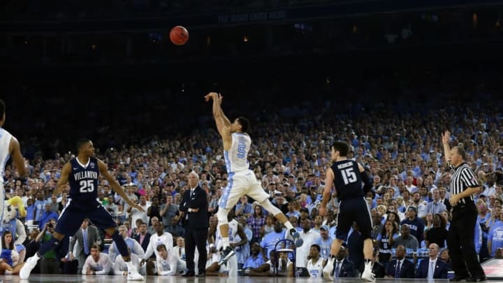 Apr 4, 2016; Houston, TX, USA; North Carolina Tar Heels guard Marcus Paige (5) hits a three point shot with 4.7 seconds over Villanova Wildcats guard Ryan Arcidiacono (15) in the championship game of the 2016 NCAA Men