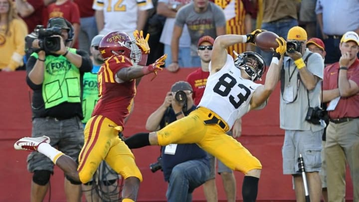 Sep 12, 2015; Ames, IA, USA; Iowa Hawkeyes wide receiver Riley McCarron (83) catches the winning touchdown in the 4th quarter while defended by Iowa State Cyclones defensive back Jomal Wiltz (17) at Jack Trice Stadium. Iowa beat Iowa State 31-17. Mandatory Credit: Reese Strickland-USA TODAY Sports