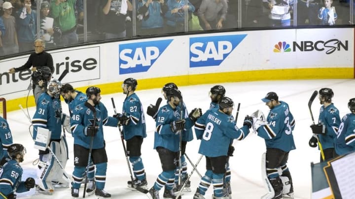 May 12, 2016; San Jose, CA, USA; San Jose Sharks center Joe Pavelski (8) and center Patrick Marleau (12) and goalie James Reimer (34) and teammates congratulate each other after the end of game seven against the Nashville Predators of the second round of the 2016 Stanley Cup Playoffs at SAP Center at San Jose. San Jose defeated Nashville 5-0. Mandatory Credit: Neville E. Guard-USA TODAY Sports