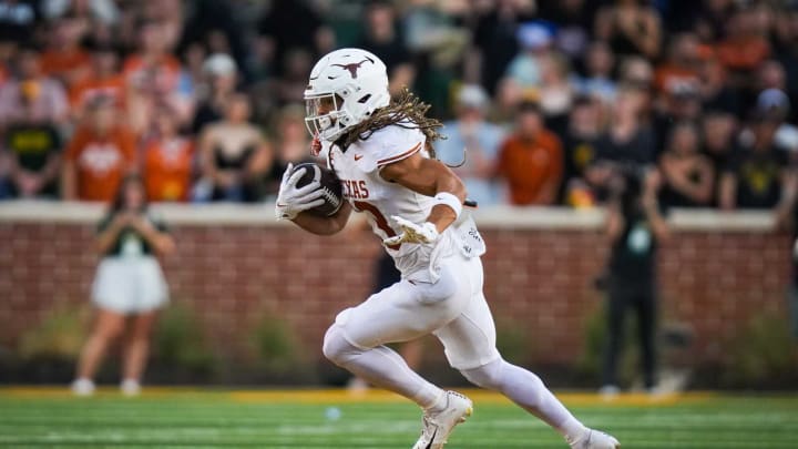 Texas wide receiver Jordan Whittington (13) carries the ball for the Longhorns in their game against the Baylor Bears, Saturday, Sept. 23 at McLane Stadium in Waco.
