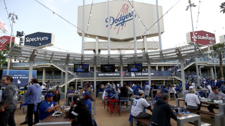 LOS ANGELES, CALIFORNIA - OCTOBER 11: Fans drink beverages before game 3 of the National League Division Series between the Los Angeles Dodgers and the San Francisco Giants at Dodger Stadium on October 11, 2021 in Los Angeles, California. (Photo by Ronald Martinez/Getty Images)