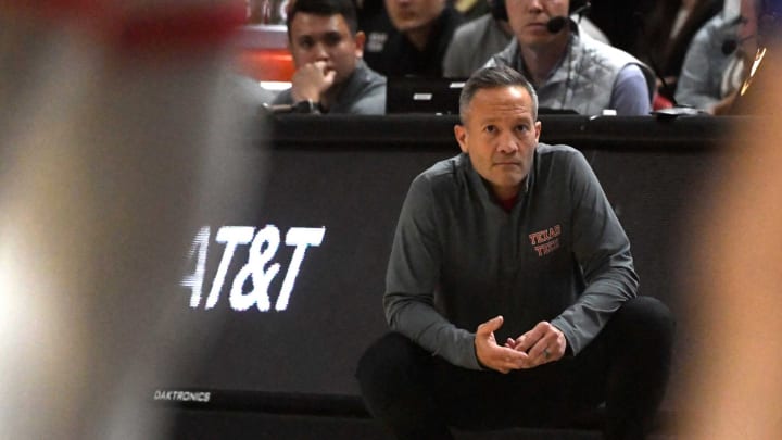 Texas Tech’s head coach Grant McCasland squats on the sidelines during the non conference basketball game against San Jose State, Sunday, Nov. 12, 2023, at United Supermarkets Arena.