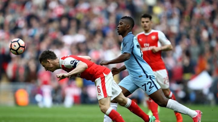LONDON, ENGLAND - APRIL 23: Laurent Koscielny of Arsenal heads the ball in front of Kelechi Iheanacho of Manchester City during the Emirates FA Cup Semi-Final match between Arsenal and Manchester City at Wembley Stadium on April 23, 2017 in London, England. (Photo by Julian Finney/Getty Images,)