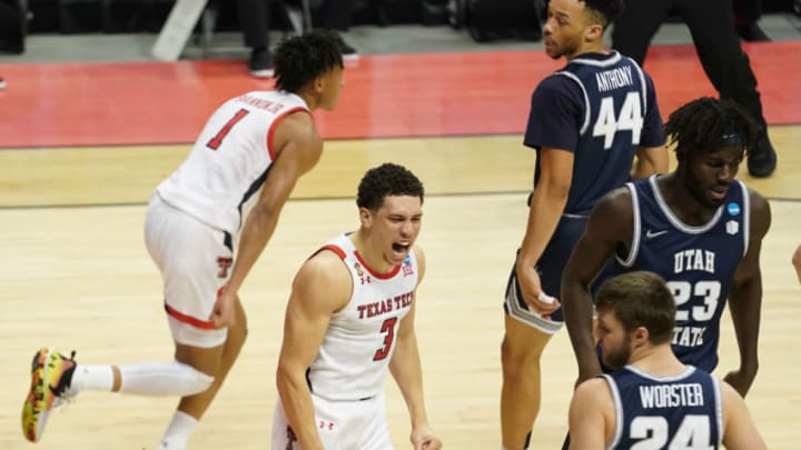 Mar 19, 2021; Bloomington, Indiana, USA; Texas Tech Red Raiders guard Clarence Nadolny (3) reacts after guard Terrence Shannon Jr. (1) scores a basket against the Utah State Aggies during the second half in the first round of the 2021 NCAA Tournament at Simon Skjodt Assembly Hall. Mandatory Credit: Robert Goddin-USA TODAY Sports