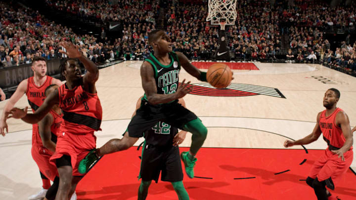 PORTLAND, OR - MARCH 23: Terry Rozier #12 of the Boston Celtics drives to the basket against the Portland Trail Blazers on March 23, 2018 at the Moda Center Arena in Portland, Oregon. NOTE TO USER: User expressly acknowledges and agrees that, by downloading and or using this photograph, user is consenting to the terms and conditions of the Getty Images License Agreement. Mandatory Copyright Notice: Copyright 2018 NBAE (Photo by Cameron Browne/NBAE via Getty Images)
