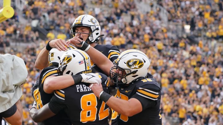 Sep 4, 2021; Columbia, Missouri, USA; Missouri Tigers tight end Niko Hea (48) celebrates with tight end Daniel Parker Jr. (82) and quarterback Connor Bazelak (8) after scoring against the Central Michigan Chippewas during the second half at Faurot Field at Memorial Stadium. Mandatory Credit: Denny Medley-USA TODAY Sports