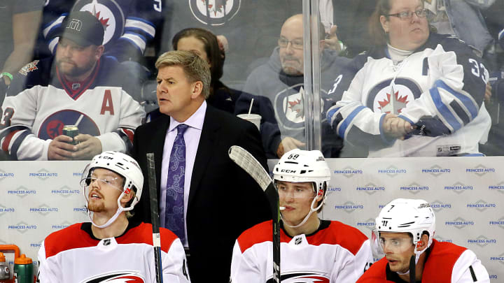 WINNIPEG, MB – OCTOBER 14: Head Coach Bill Peters of the Carolina Hurricanes looks on from the bench during third period action against the Winnipeg Jets at the Bell MTS Place on October 14, 2017 in Winnipeg, Manitoba, Canada. (Photo by Jonathan Kozub/NHLI via Getty Images)