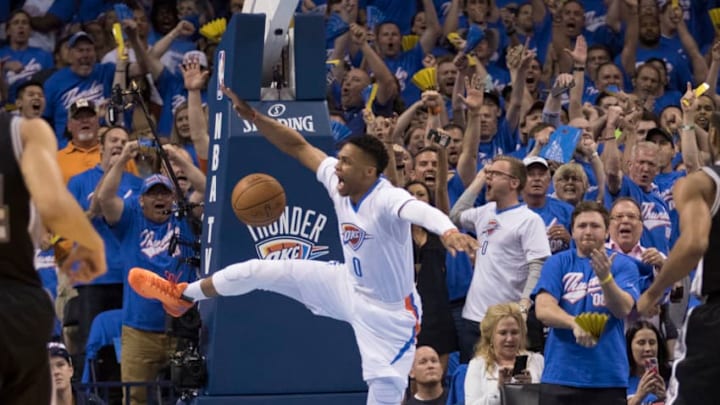 OKLAHOMA CITY, OK - MAY 6: After stealing the ball from the San Antonio Spurs Russell Westbrook #0 of the Oklahoma City Thunder reacts after he dunks two points during the first half of Game Three of the Western Conference Semifinals during the 2016 NBA Playoffs at the Chesapeake Energy Arena on May 6, 2016 in Oklahoma City, Oklahoma. NOTE TO USER: User expressly acknowledges and agrees that, by downloading and or using this photograph, User is consenting to the terms and conditions of the Getty Images License Agreement. (Photo by J Pat Carter/Getty Images)