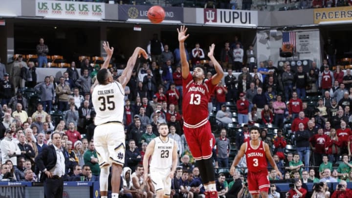 INDIANAPOLIS, IN - DECEMBER 16: Bonzie Colson #35 of the Notre Dame Fighting Irish shoots a last second three-point shot against Juwan Morgan #13 of the Indiana Hoosiers during the Crossroads Classic at Bankers Life Fieldhouse on December 16, 2017 in Indianapolis, Indiana. Indiana won 80-77 in overtime. (Photo by Joe Robbins/Getty Images)