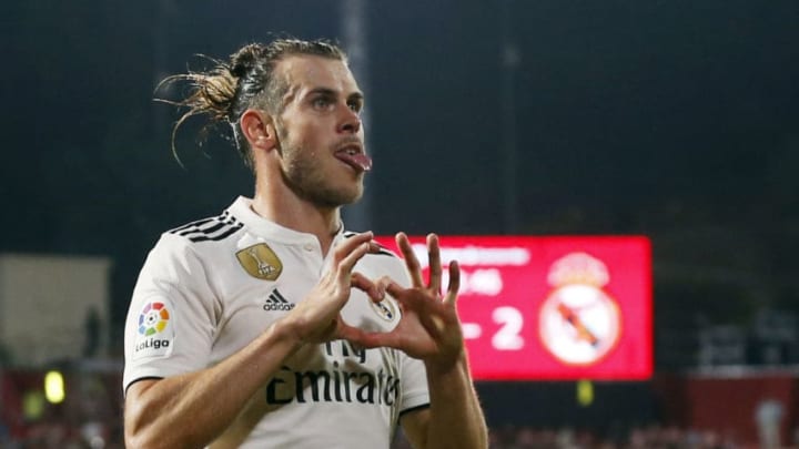 TOPSHOT - Real Madrid's Welsh forward Gareth Bale celebrates scoring his team's third goal during the Spanish league football match between Girona FC and Real Madrid CF at the Montilivi stadium in Girona on August 26, 2018. (Photo by Pau BARRENA CAPILLA / AFP) (Photo credit should read PAU BARRENA CAPILLA/AFP/Getty Images)