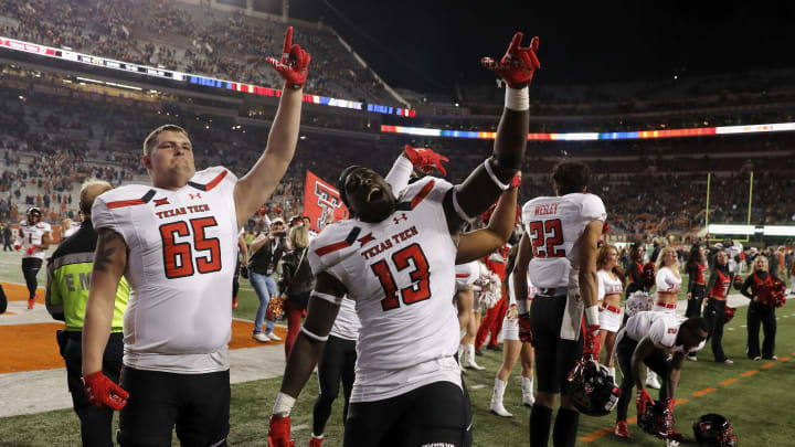 Kolin Hill #13 of the Texas Tech Red Raiders and Zach Adams #65 celebrate after the game against the Texas Longhorns at Darrell K Royal-Texas Memorial Stadium on November 24, 2017 in Austin, Texas. (Photo by Tim Warner/Getty Images)
