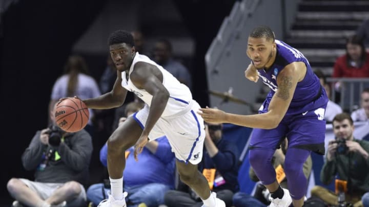 CHARLOTTE, NC - MARCH 16: Khyri Thomas #2 of the Creighton Bluejays moves the ball down the court under coverage from Levi Stockard III #34 of the Kansas State Wildcats in the first round of the 2018 NCAA Men's Basketball Tournament held at the Spectrum Center on March 16, 2018 in Charlotte, North Carolina. (Photo by Grant Halverson/NCAA Photos via Getty Images)