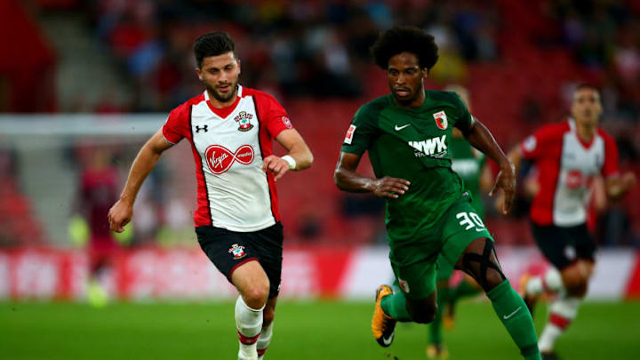 SOUTHAMPTON, ENGLAND - AUGUST 02: Shane Long of Southampton tackles with Francisco da Silva Caiuby of FC Augsburg during the Pre-Season Friendly match between Southampton and FC Augsburg at St Mary's Stadium on August 2, 2017 in Southampton, England. (Photo by Jordan Mansfield/Getty Images)