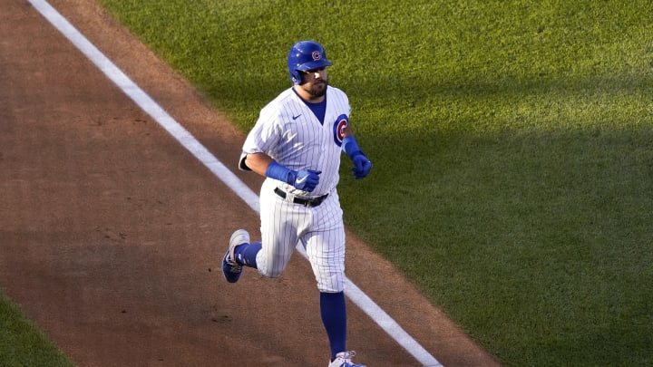 CHICAGO, ILLINOIS – AUGUST 13: Kyle Schwarber #12 of the Chicago Cubs rounds the bases following his home run during the second inning of a game against the Milwaukee Brewers at Wrigley Field on August 13, 2020 in Chicago, Illinois. (Photo by Nuccio DiNuzzo/Getty Images)