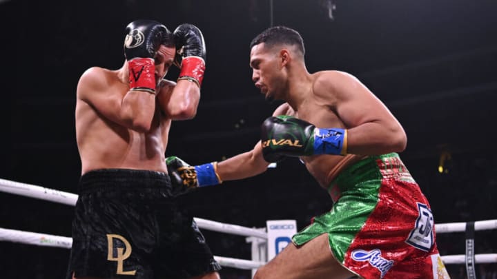 GLENDALE, ARIZONA - MAY 21: David Benavidez (R) throws a right at David Lemieux during their WBC Super Middleweight Interim Title fight at Gila River Arena on May 21, 2022 in Glendale, Arizona. (Photo by Kelsey Grant/Getty Images)