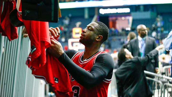 Mar 13, 2017; Charlotte, NC, USA; Chicago Bulls guard Dwyane Wade (3) signs autographs for fans after the game against the Charlotte Hornetsat Spectrum Center. The Bulls won 115-109. Mandatory Credit: Jeremy Brevard-USA TODAY Sports