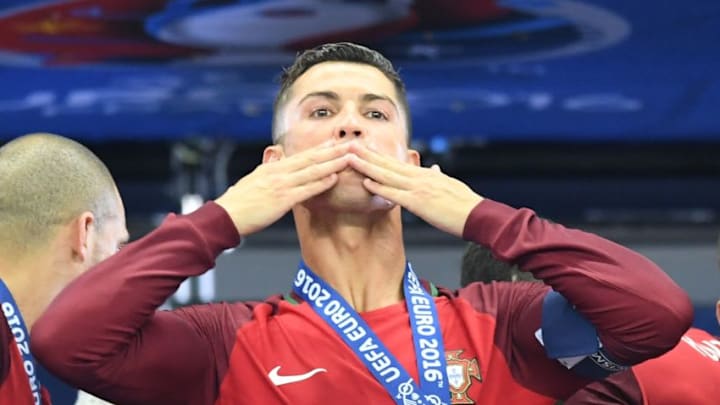 PARIS, FRANCE - JULY 10: Portugal's forward Cristiano Ronaldo celebrates as he poses after Portugal won the Euro 2016 final football match between Portugal and France at the Stade de France in Saint-Denis, north of Paris, on July 10, 2016. (Photo by Mustafa Yalcin/Anadolu Agency/Getty Images)