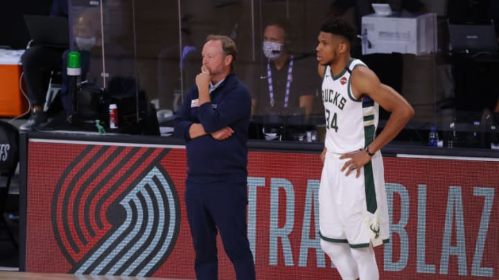 LAKE BUENA VISTA, FLORIDA - AUGUST 29: Mike Budenholzer and Giannis Antetokounmpo #34 of the Milwaukee Bucks look on against the Orlando Magic during the fourth quarter in Game Five of the Eastern Conference First Round during the 2020 NBA Playoffs at AdventHealth Arena at ESPN Wide World Of Sports Complex on August 29, 2020 in Lake Buena Vista, Florida. NOTE TO USER: User expressly acknowledges and agrees that, by downloading and or using this photograph, User is consenting to the terms and conditions of the Getty Images License Agreement. (Photo by Kevin C. Cox/Getty Images)