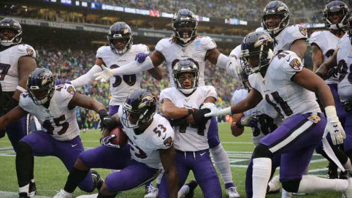 SEATTLE, WASHINGTON - OCTOBER 20: The Baltimore Ravens celebrate a 18 yard fumble recovery touchdown by Marlon Humphrey #44 of the Baltimore Ravens in the fourth quarter against the Seattle Seahawks during their game at CenturyLink Field on October 20, 2019 in Seattle, Washington. (Photo by Abbie Parr/Getty Images)
