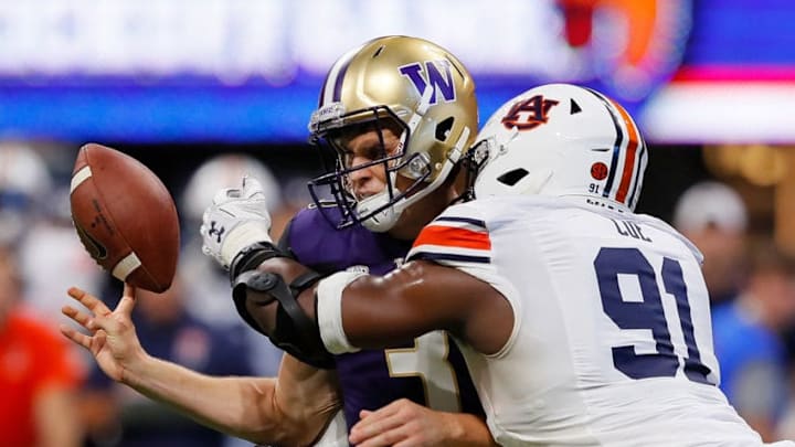 ATLANTA, GA - SEPTEMBER 01: Nick Coe #91 of the Auburn Tigers forces a fumble as he knocks the ball from the hands of Jake Browning #3 of the Washington Huskies at Mercedes-Benz Stadium on September 1, 2018 in Atlanta, Georgia. (Photo by Kevin C. Cox/Getty Images)