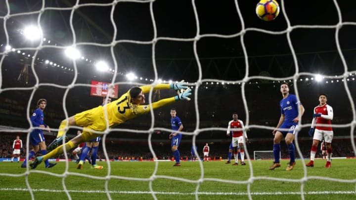 LONDON, ENGLAND - JANUARY 03: Hector Bellerin of Arsenal shoots past Thibaut Courtois of Chelsea to score his sides second goal during the Premier League match between Arsenal and Chelsea at Emirates Stadium on January 3, 2018 in London, England. (Photo by Julian Finney/Getty Images)