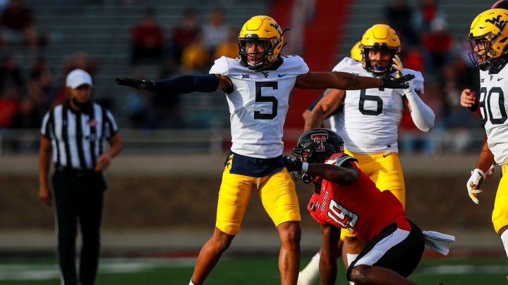 LUBBOCK, TEXAS – OCTOBER 24: Cornerback Dreshun Miller #5 of the West Virginia Mountaineers signals after breaking up a pass during the first half of the college football game against the Texas Tech Red Raiders on October 24, 2020 at Jones AT&T Stadium in Lubbock, Texas. (Photo by John E. Moore III/Getty Images)