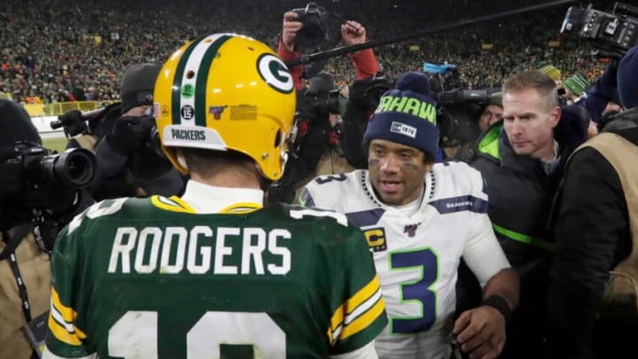 Green Bay Packers quarterback Aaron Rodgers (12) and Seattle Seahawks quarterback Russell Wilson (3) talk after the Green Bay Packers 28-23 win over the Seattle Seahawks.Packers13 14 Wood