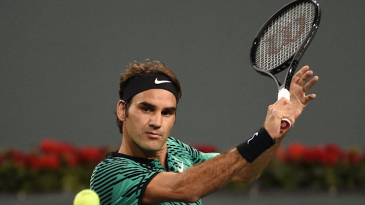 INDIANS WELLS, CA - MARCH 12: Roger Federer of Switzerland hits a backhand against Stephane Robert of France at the BNP Paribas Open at Indian Wells Tennis Garden on March 12, 2017 in Indian Wells, California. (Photo by Kevork Djansezian/Getty Images)