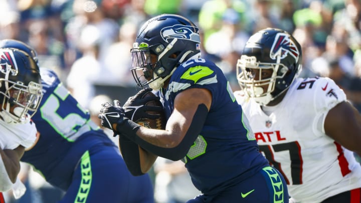 Sep 25, 2022; Seattle, Washington, USA; Seattle Seahawks running back Rashaad Penny (20) rushes against the Atlanta Falcons during the first quarter at Lumen Field. Mandatory Credit: Joe Nicholson-USA TODAY Sports