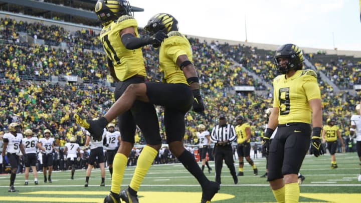 Oct 30, 2021; Eugene, Oregon, USA; Oregon Ducks wide receiver Troy Franklin (11) celebrates with wide receiver Jaylon Redd (6) after catching a touchdown pass during the first half agains the Colorado Buffaloes at Autzen Stadium. Mandatory Credit: Troy Wayrynen-USA TODAY Sports