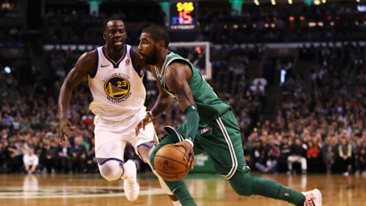 BOSTON, MA - NOVEMBER 16: Kyrie Irving #11 of the Boston Celtics dribbles against Draymond Green #23 of the Golden State Warriors during the third quarter at TD Garden on November 16, 2017 in Boston, Massachusetts. The Celtics defeat the Warriors 92-88. (Photo by Maddie Meyer/Getty Images)