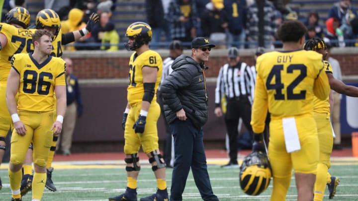 Jim Harbaugh is on the field during the Michigan spring game Saturday, April 2, 2022, at Michigan Stadium.