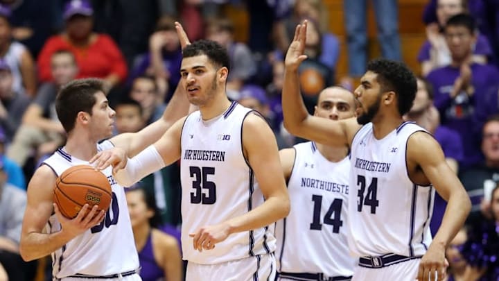 Mar 6, 2016; Evanston, IL, USA; Northwestern Wildcats players Aaron Falzon (35) , Bryant McIntosh (30) , Tre Demps (14) and Sanjay Lumpkin (34) celebrate in the second half against the Nebraska Cornhuskers at Welsh-Ryan Arena. Mandatory Credit: Jerry Lai-USA TODAY Sports