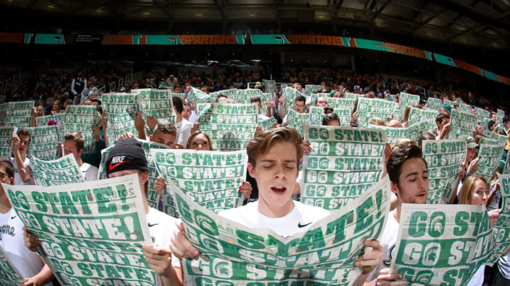 EAST LANSING, MI – NOVEMBER 11: Fans in the student section of the Michigan State Spartans read the paper as the Florida Gulf Coast Eagles are being introduced before the game at at Breslin Center on November 11, 2018 in East Lansing, Michigan. (Photo by Rey Del Rio/Getty Images)