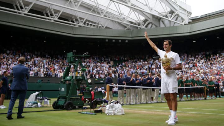 LONDON, ENGLAND - JULY 16: Roger Federer of Switzerland celebrates victory with the trophy after the Gentlemen's Singles final against Marin Cilic of Croatia on day thirteen of the Wimbledon Lawn Tennis Championships at the All England Lawn Tennis and Croquet Club at Wimbledon on July 16, 2017 in London, England. (Photo by Daniel Leal-Olivas - Pool/Getty Images)