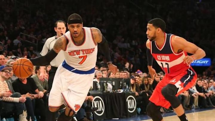 Feb 9, 2016; New York, NY, USA; New York Knicks forward Carmelo Anthony (7) drives around Washington Wizards guard Garrett Temple (17) during the fourth quarter at Madison Square Garden. Washington Wizards won111-108. Mandatory Credit: Anthony Gruppuso-USA TODAY Sports