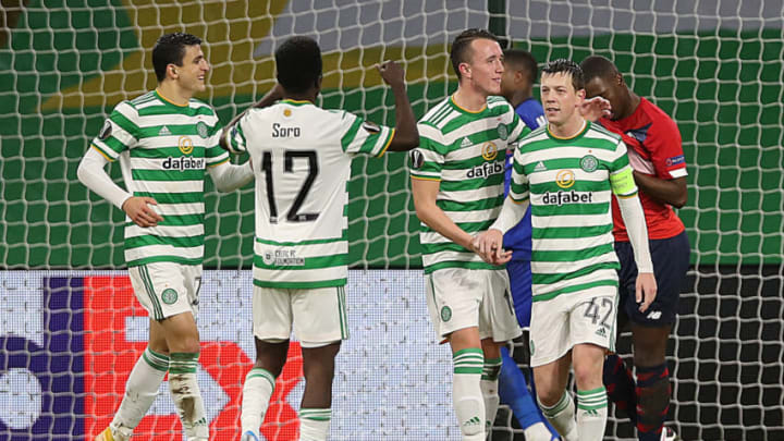 GLASGOW, SCOTLAND - DECEMBER 10: Callum McGregor of Celtic celebrates with his team after he scores their team's second goal from the penalty spot during the UEFA Europa League Group H stage match between Celtic and LOSC Lille at Celtic Park on December 10, 2020 in Glasgow, Scotland. The match will be played without fans, behind closed doors as a Covid-19 precaution. (Photo by Ian MacNicol/Getty Images)