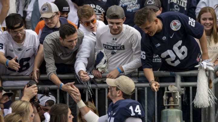 STATE COLLEGE, PA - SEPTEMBER 25: Sean Clifford #14 of the Penn State Nittany Lions celebrates with fans after the game against the Villanova Wildcats at Beaver Stadium on September 25, 2021 in State College, Pennsylvania. (Photo by Scott Taetsch/Getty Images)